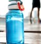 Bottle of water on plank in a park
