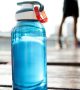 Bottle of water on plank in a park