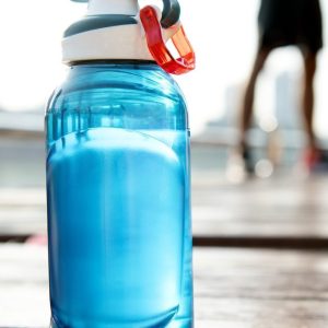 Bottle of water on plank in a park