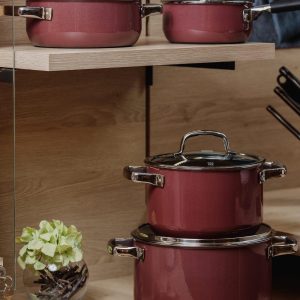 side view of cooking set of pots and pans on wooden shelves jpg